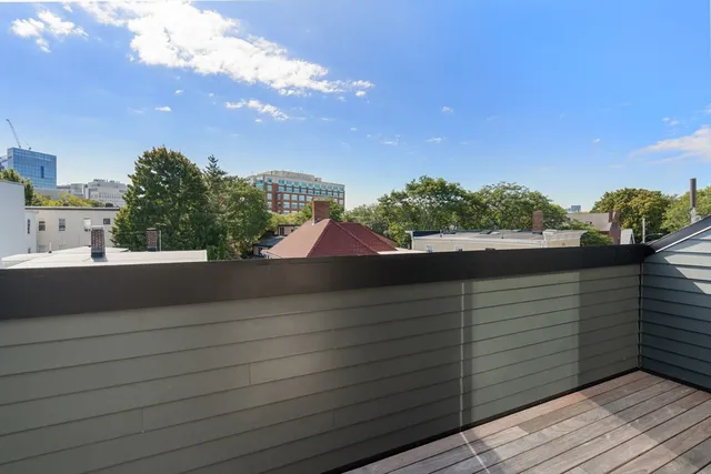 a view of a balcony with city view