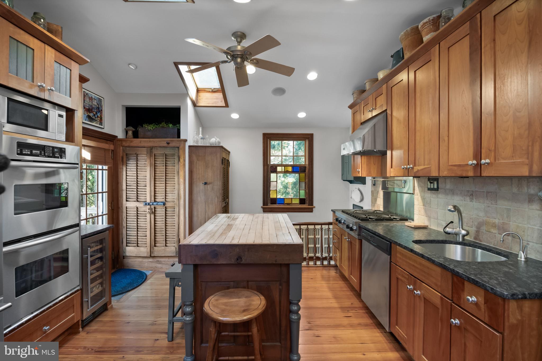 269 East 3rd Street Moorestown, NJ 08057 - Photo 14 of 52 a kitchen with stainless steel appliances a stove sink refrigerator and cabinets