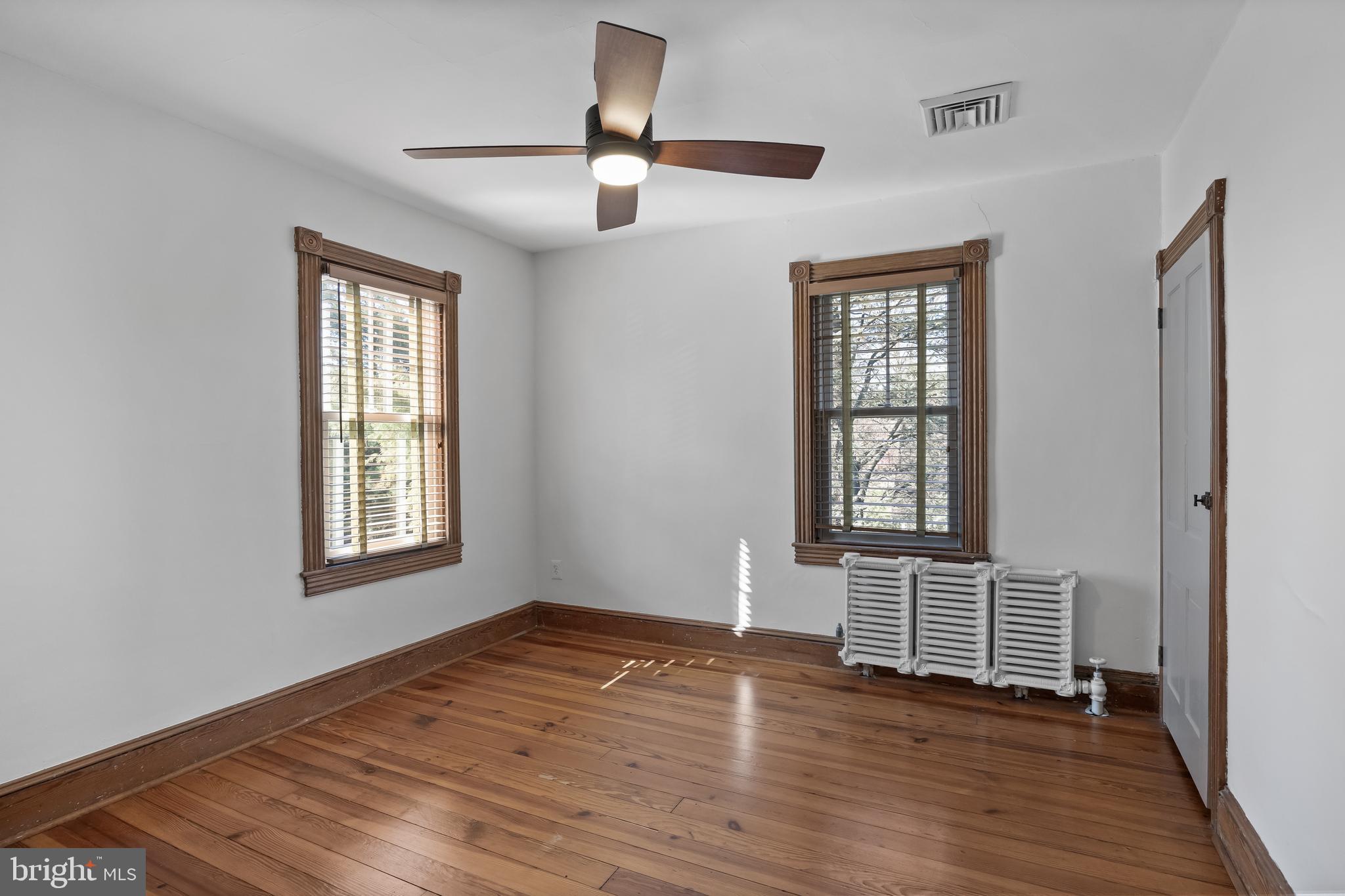 269 East 3rd Street Moorestown, NJ 08057 - Photo 21 of 52 a view of an empty room with wooden floor and a window