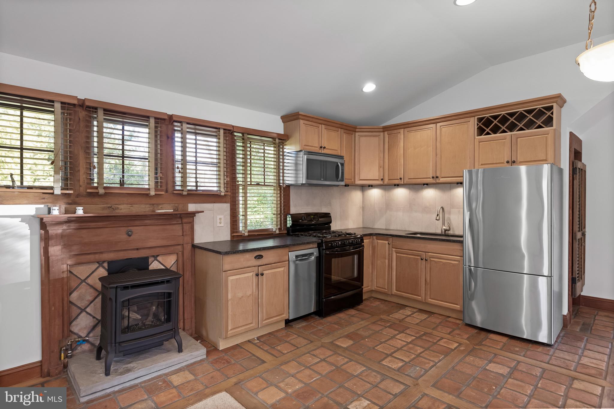 269 East 3rd Street Moorestown, NJ 08057 - Photo 39 of 52 a kitchen with granite countertop a refrigerator stove top oven and sink