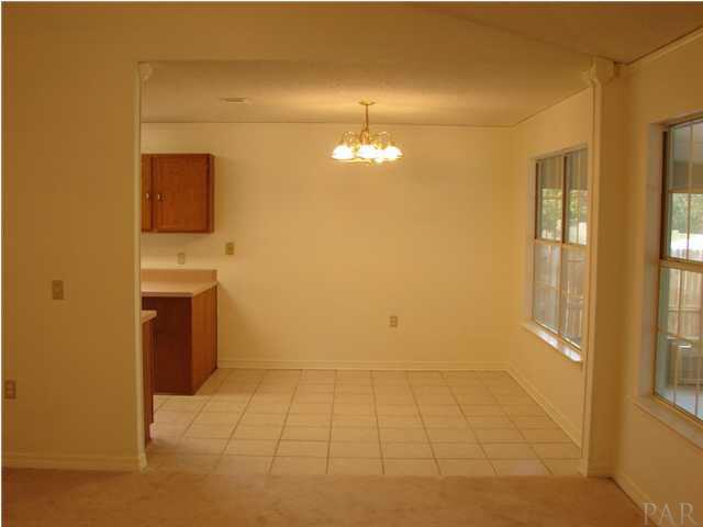 2740 River Run Road Navarre, FL 32566 - Photo 6 of 15 LARGE KITCHEN EATING AREA WITH VIEW OF FLORIDA ROOM AND BACK YARD!