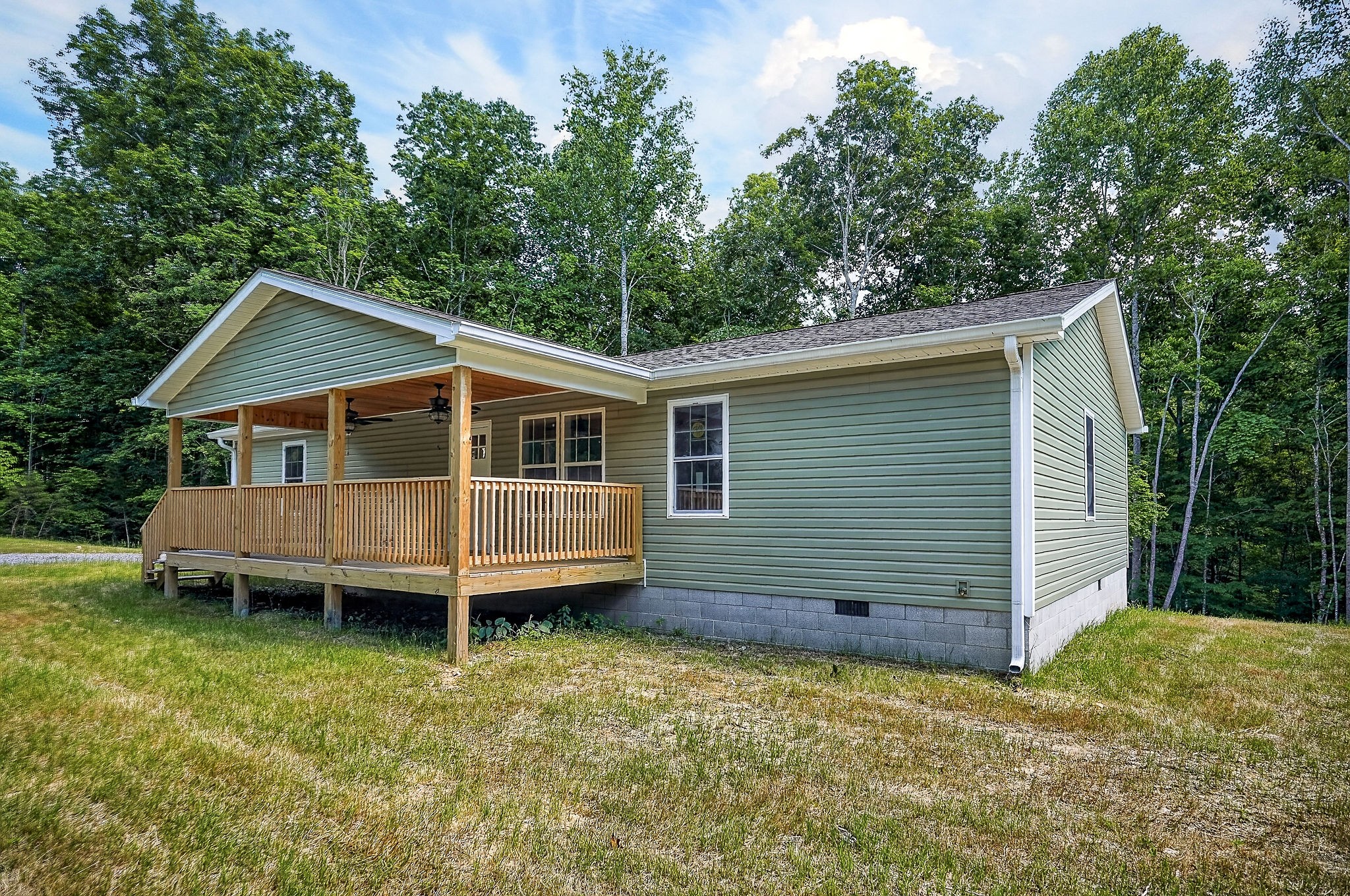 1053 Benton Tidwell Road Hilham, TN 38568 - Photo 24 of 39 a view of a house with a backyard