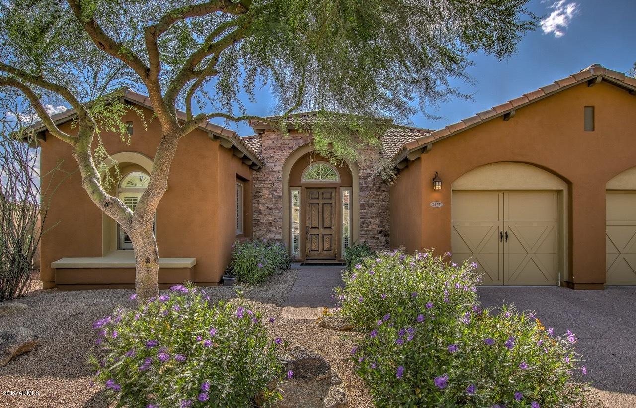 3977 East Hashknife Road Phoenix, AZ 85050 - Photo 28 of 28 a front view of a house with garden