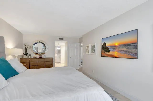 a bedroom with bed and window