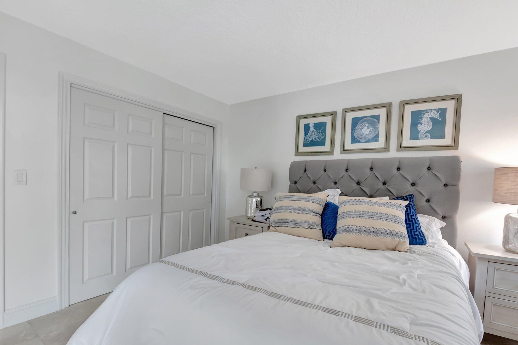 7370 Orangewood Lane, Unit 107 Boca Raton, FL 33433 - Photo 23 of 78 a bedroom with bed and window