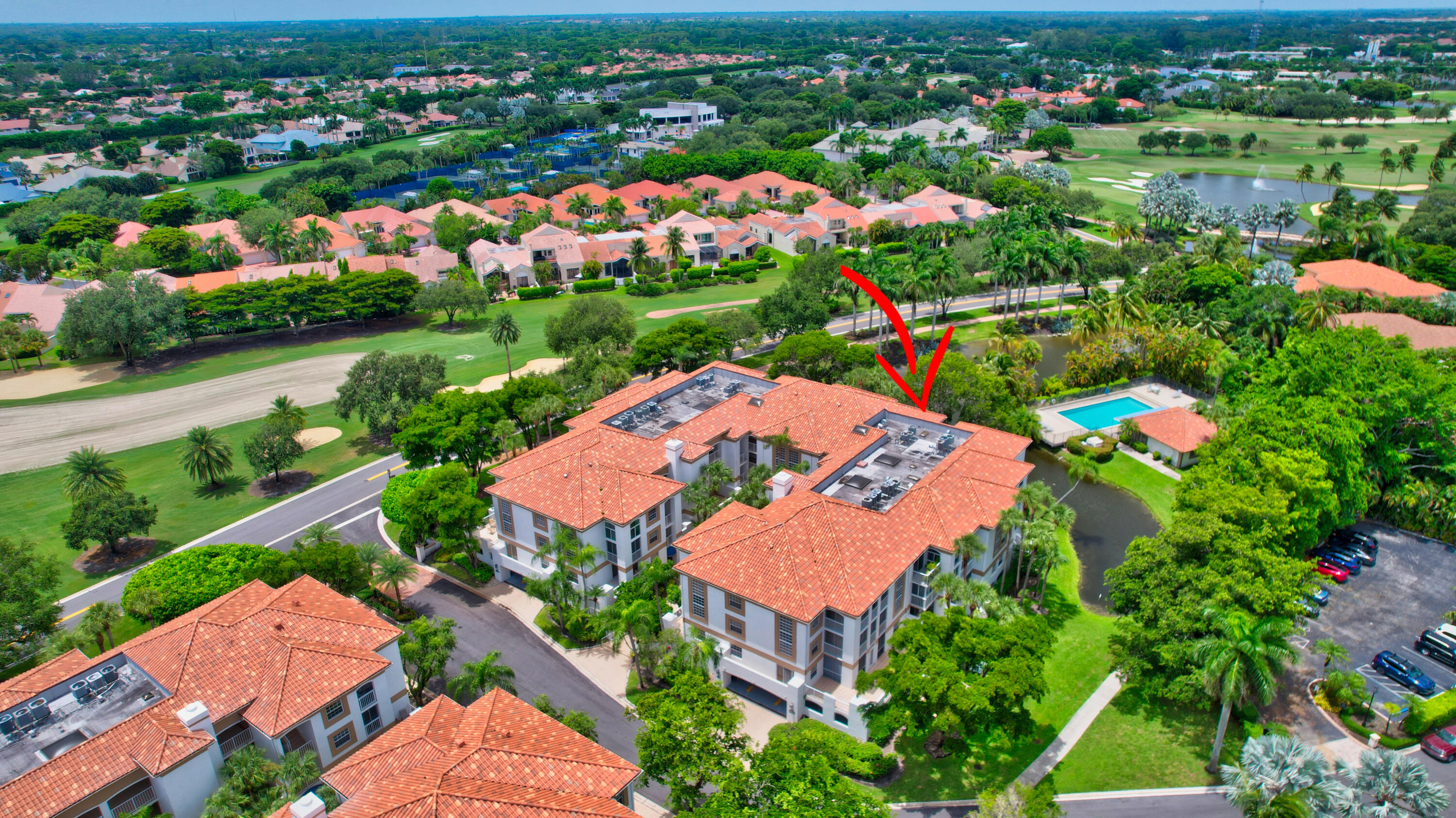 7370 Orangewood Lane, Unit 107 Boca Raton, FL 33433 - Photo 32 of 78 an aerial view of residential houses with outdoor space and lake view