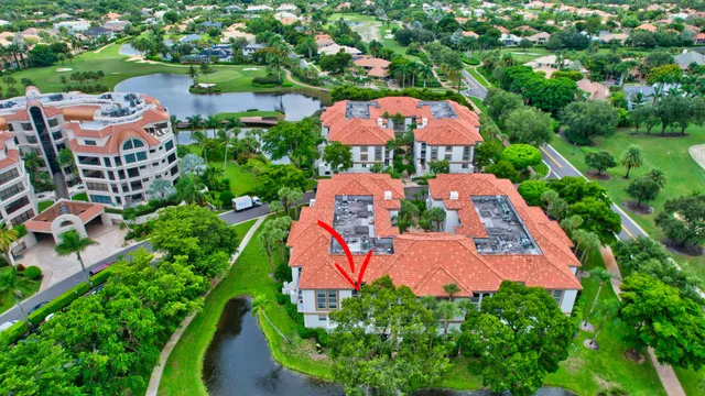 an aerial view of a house with yard