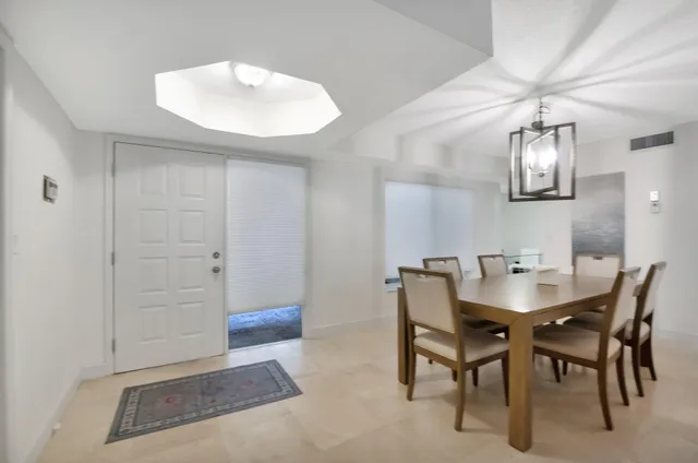 a view of a livingroom with furniture and a chandelier