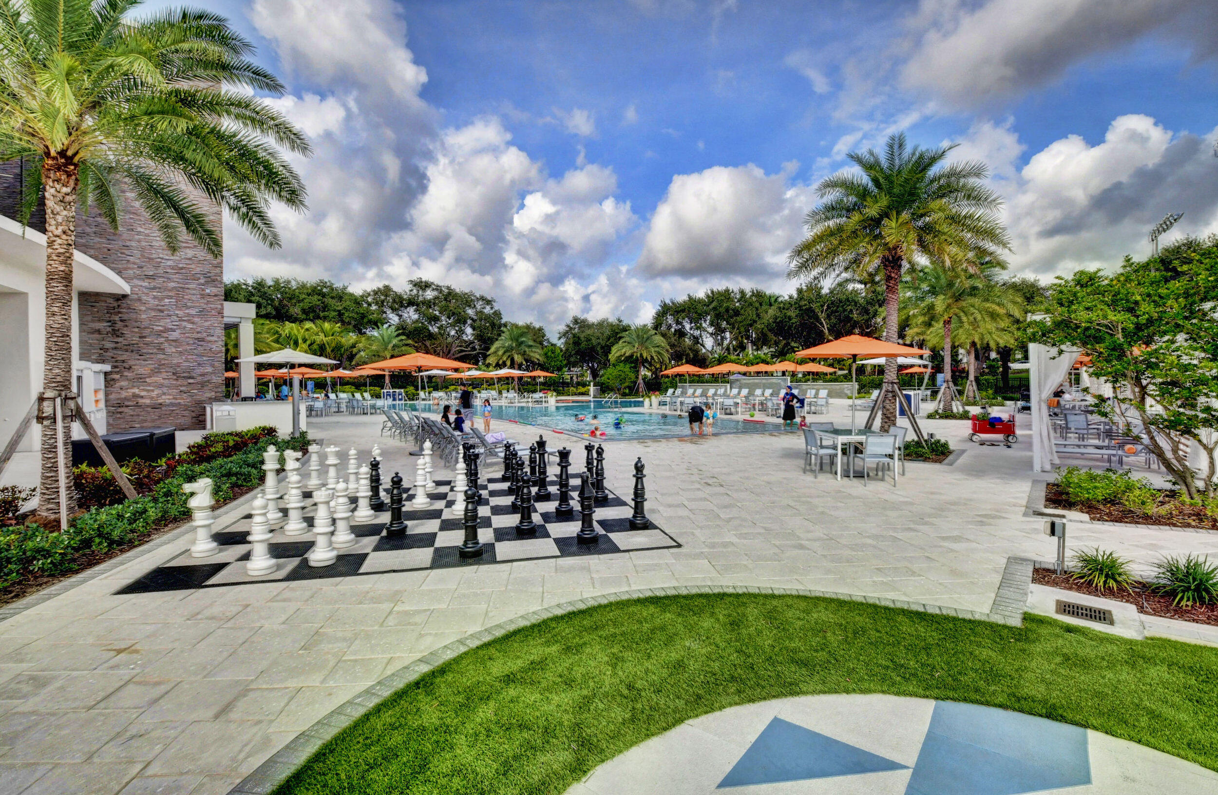 7370 Orangewood Lane, Unit 107 Boca Raton, FL 33433 - Photo 65 of 78 a view of a park with swings and slides