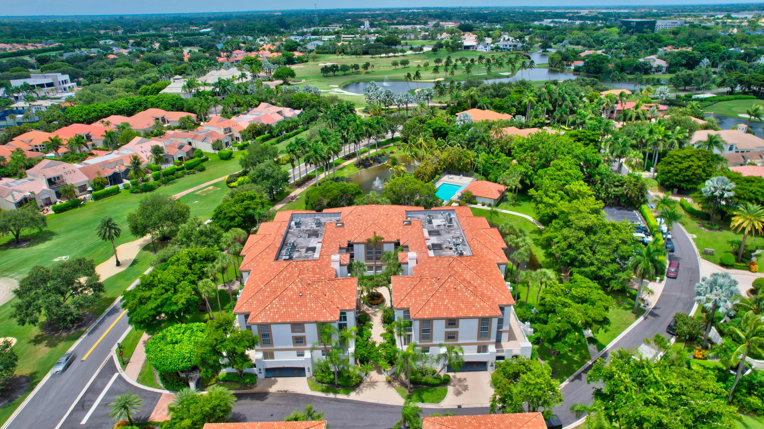 7370 Orangewood Lane, Unit 107 Boca Raton, FL 33433 - Photo 77 of 78 an aerial view of house with swimming pool and outdoor seating