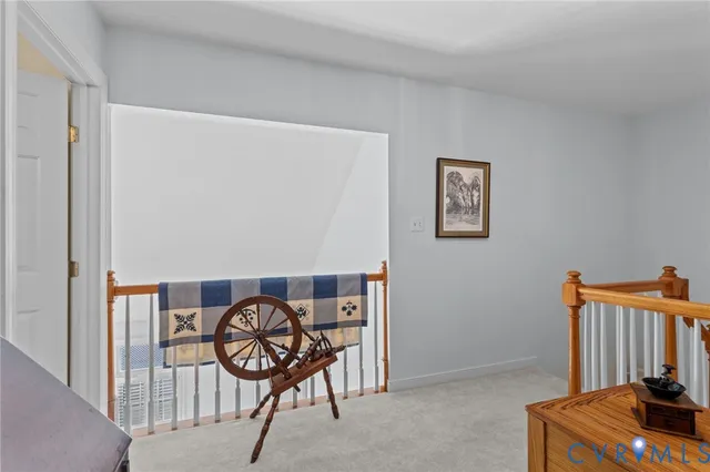 a living room with furniture rug and a fireplace