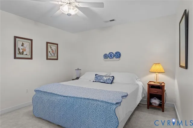 a bedroom with a bed and chandelier