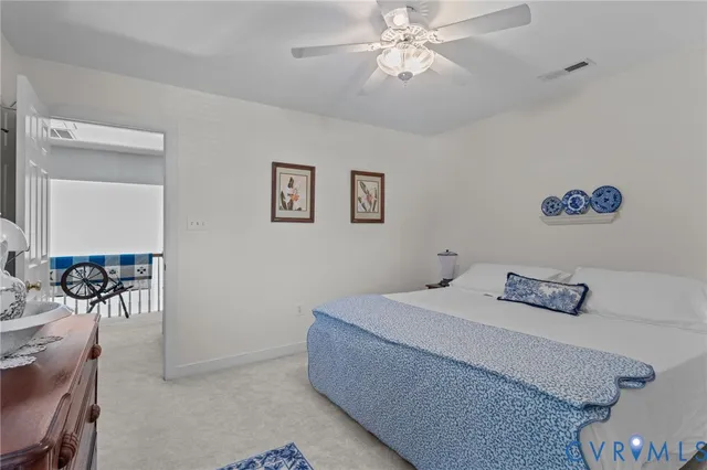 a bed room with a bed and a dresser