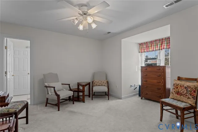 a view of room with workspace and windows