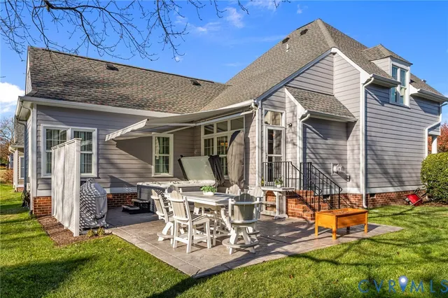 a view of backyard with barbeque grill and outdoor seating