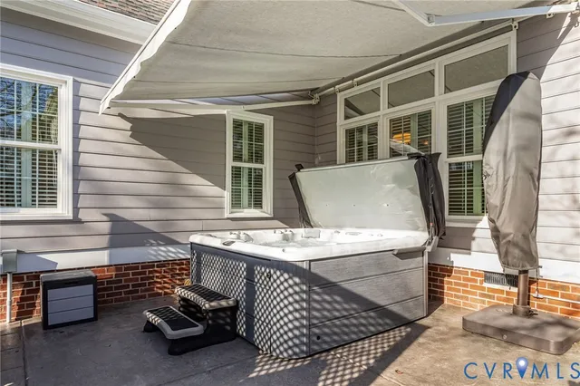 a view of a patio with couches chairs and a yard