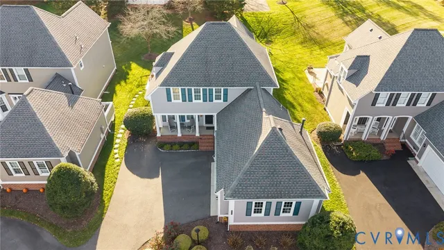 an aerial view of residential houses with outdoor space