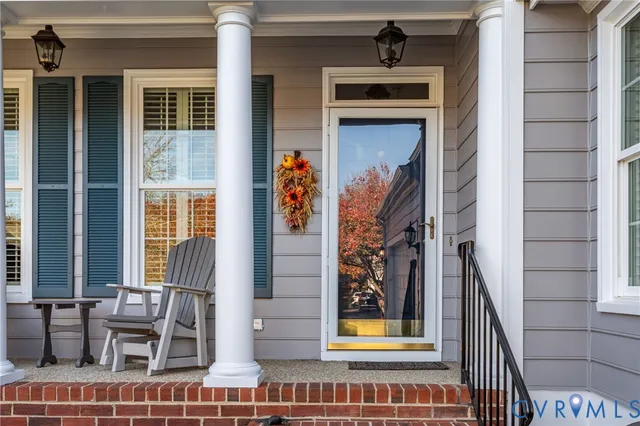 a view of front door of house with furniture