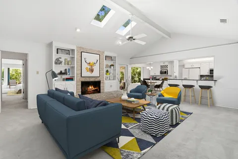 a living room with furniture and a table