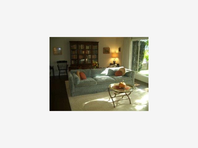 617 Alhambra Road San Mateo, CA 94402 - Photo 3 of 9 a living room with furniture and a large window