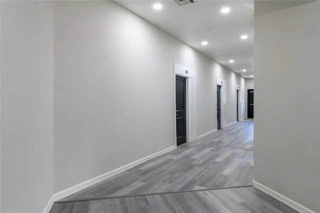 a view of a hallway with staircase