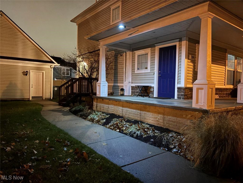 180 Elizabeth Parkway Akron, OH 44304 - Photo 42 of 46 Doorway to property with covered porch and stone siding