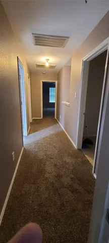 a bathroom with a toilet a sink and shower