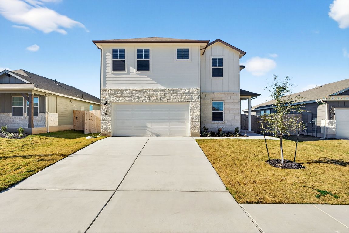 145 Honey Bee Road Jarrell, TX 76537 - Photo 1 of 27 a front view of a house with a yard