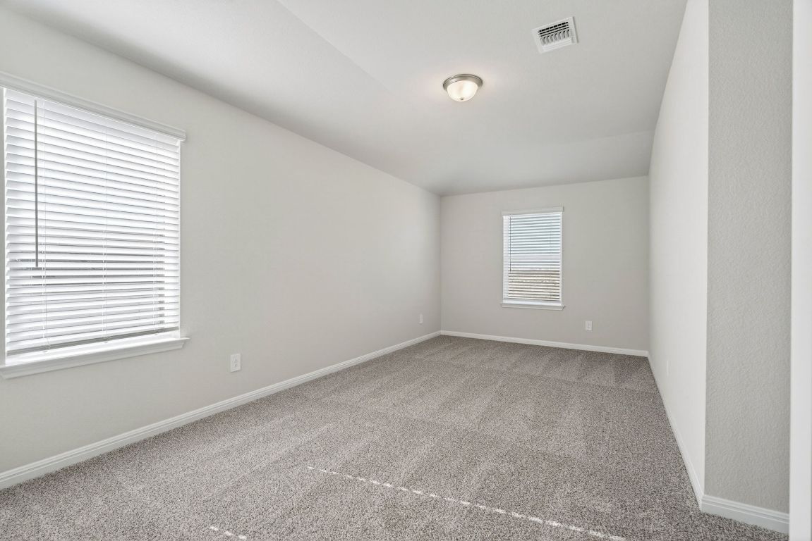 145 Honey Bee Road Jarrell, TX 76537 - Photo 12 of 27 an empty room with windows