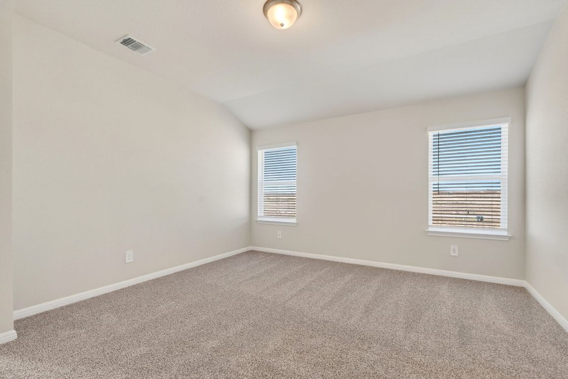 145 Honey Bee Road Jarrell, TX 76537 - Photo 14 of 27 a view of an empty room with a window