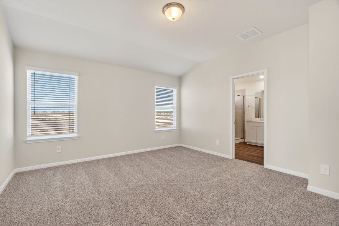 145 Honey Bee Road Jarrell, TX 76537 - Photo 18 of 27 a view of an empty room with a window and closet area