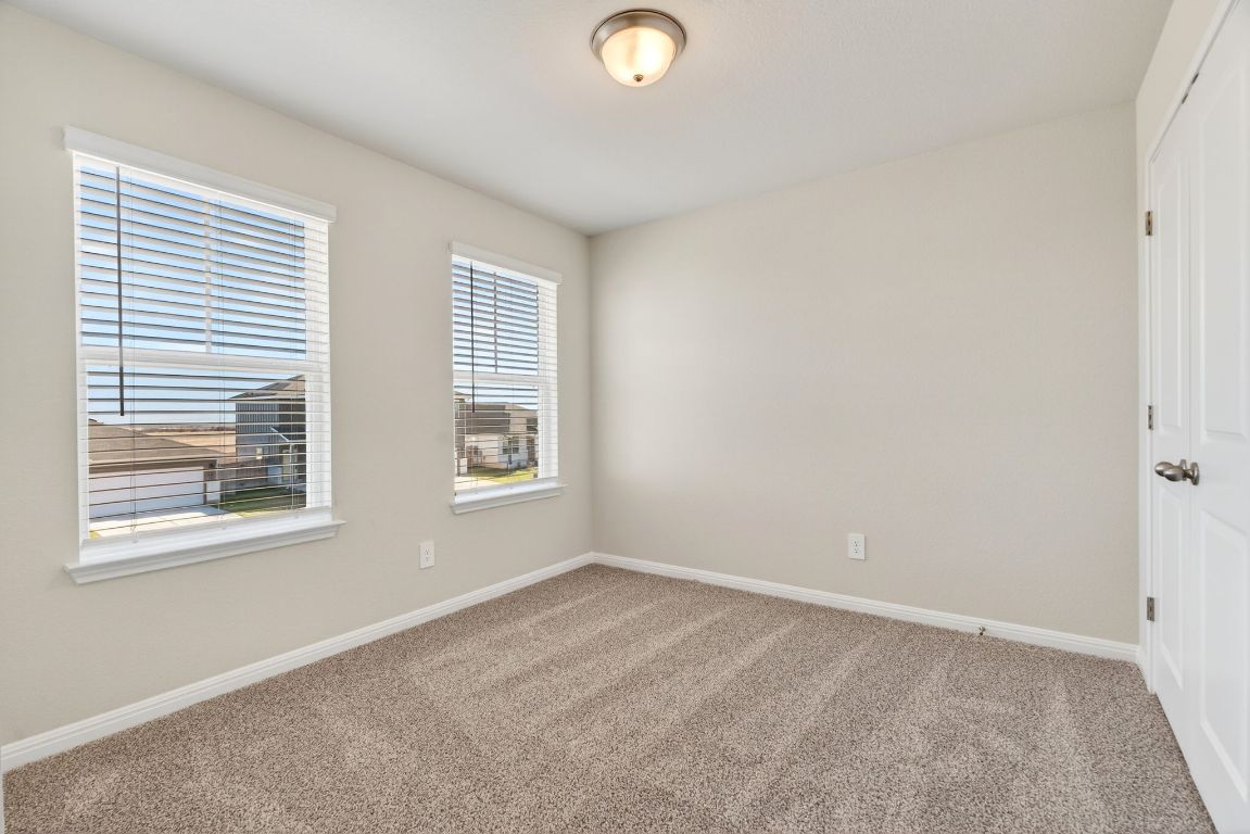 145 Honey Bee Road Jarrell, TX 76537 - Photo 21 of 27 an empty room with windows