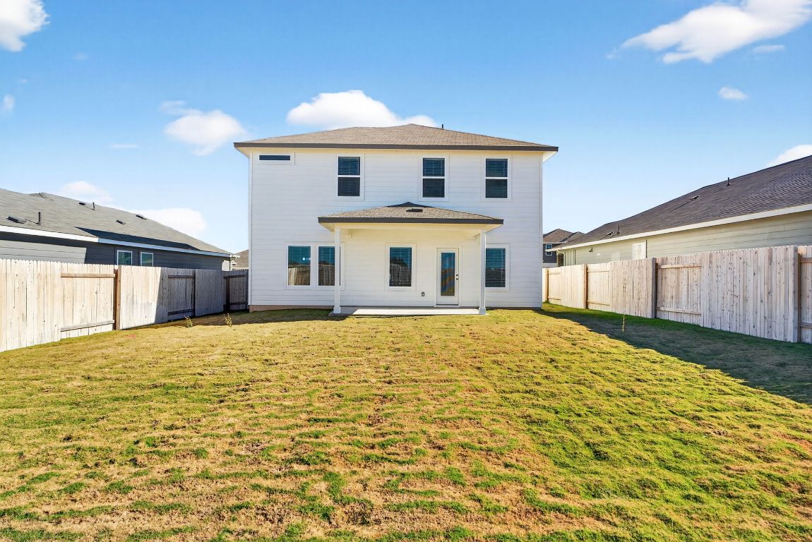 145 Honey Bee Road Jarrell, TX 76537 - Photo 26 of 27 a front view of a house with a yard