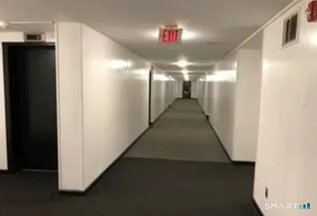 a view of gallery with windows