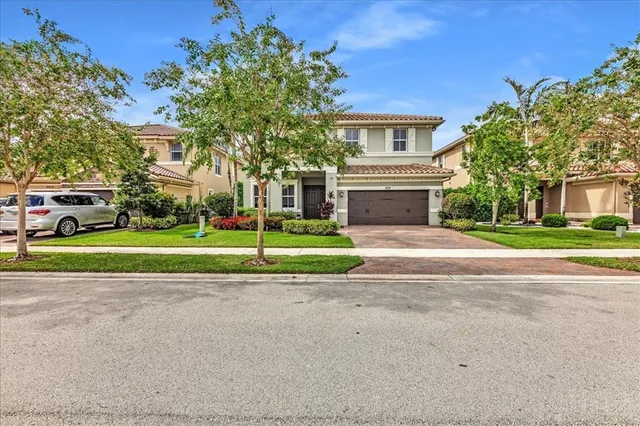 $1,274,990 | 9880 South Miralago Way, Parkland, FL 33076