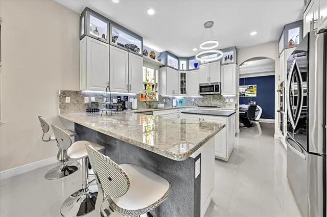 $1,274,990 | 9880 South Miralago Way, Parkland, FL 33076