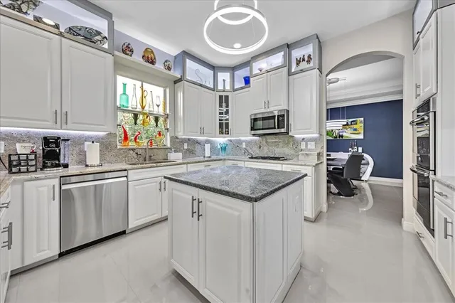 $1,274,990 | 9880 South Miralago Way, Parkland, FL 33076