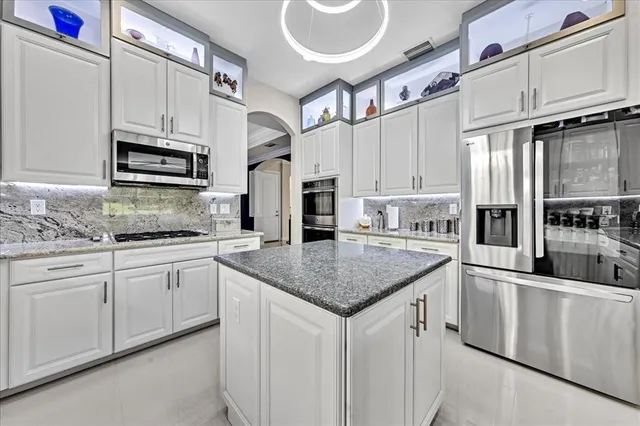 $1,274,990 | 9880 South Miralago Way, Parkland, FL 33076