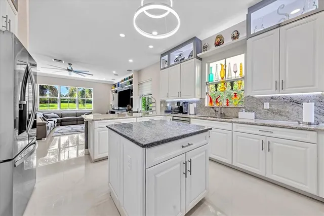 $1,274,990 | 9880 South Miralago Way, Parkland, FL 33076