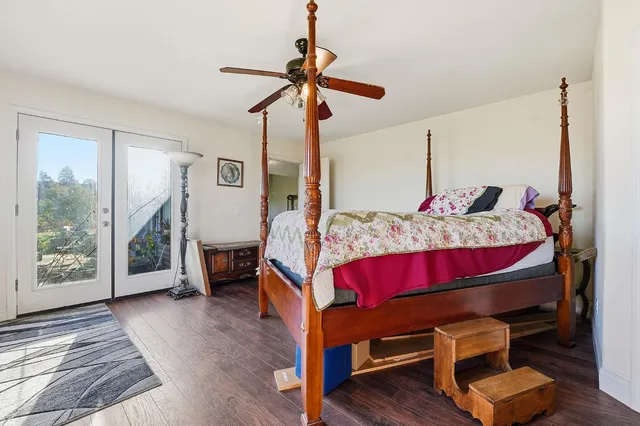 a bedroom with a bed and dresser