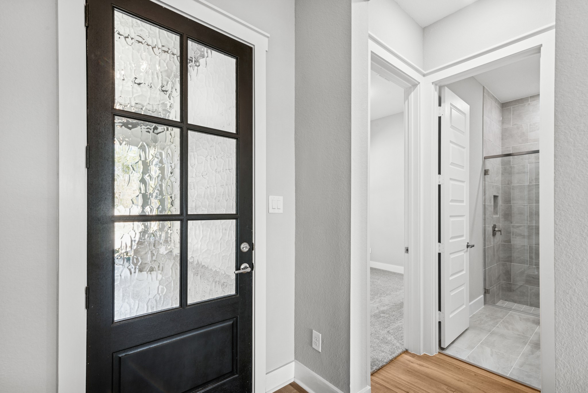16142 Rita Road Conroe, TX 77302 - Photo 12 of 48 a bathroom with a glass shower door
