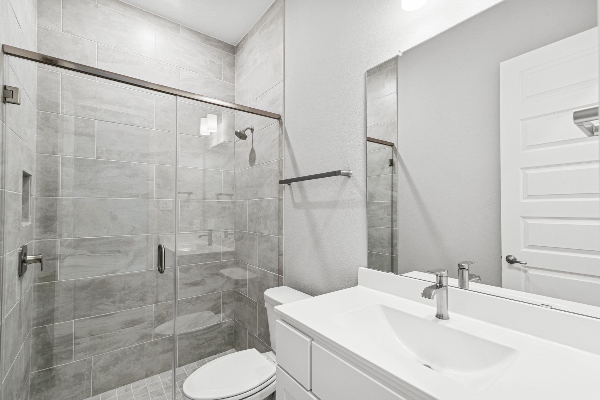 16142 Rita Road Conroe, TX 77302 - Photo 15 of 48 a bathroom with a sink toilet and shower