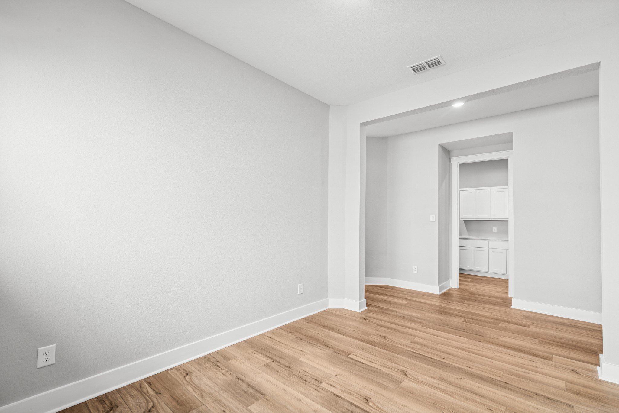 16142 Rita Road Conroe, TX 77302 - Photo 17 of 48 a view of an empty room with wooden floor