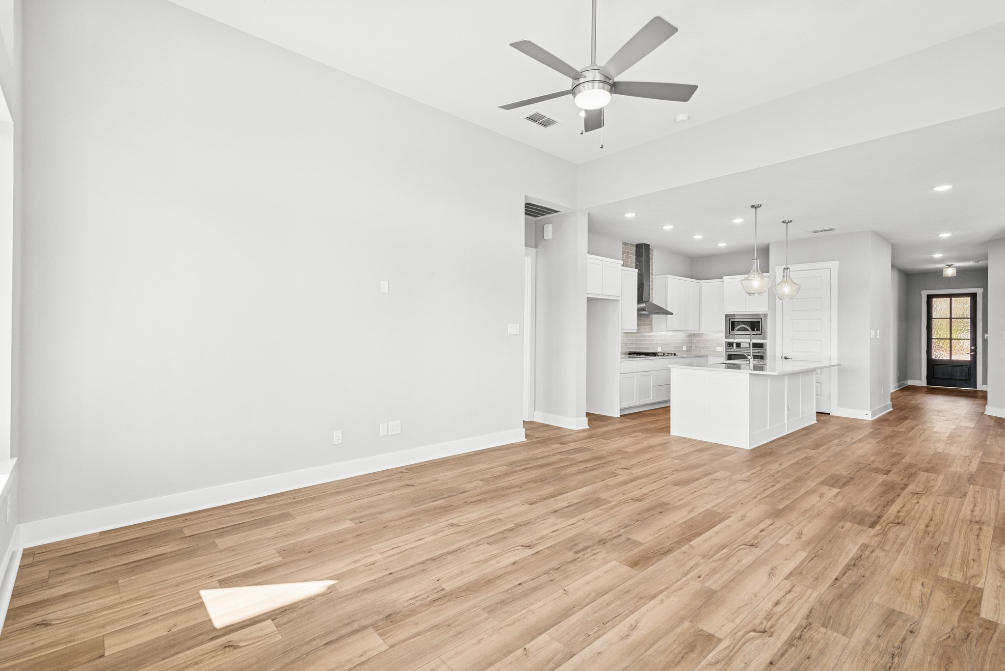 16142 Rita Road Conroe, TX 77302 - Photo 26 of 48 a view of kitchen with wooden floor and window