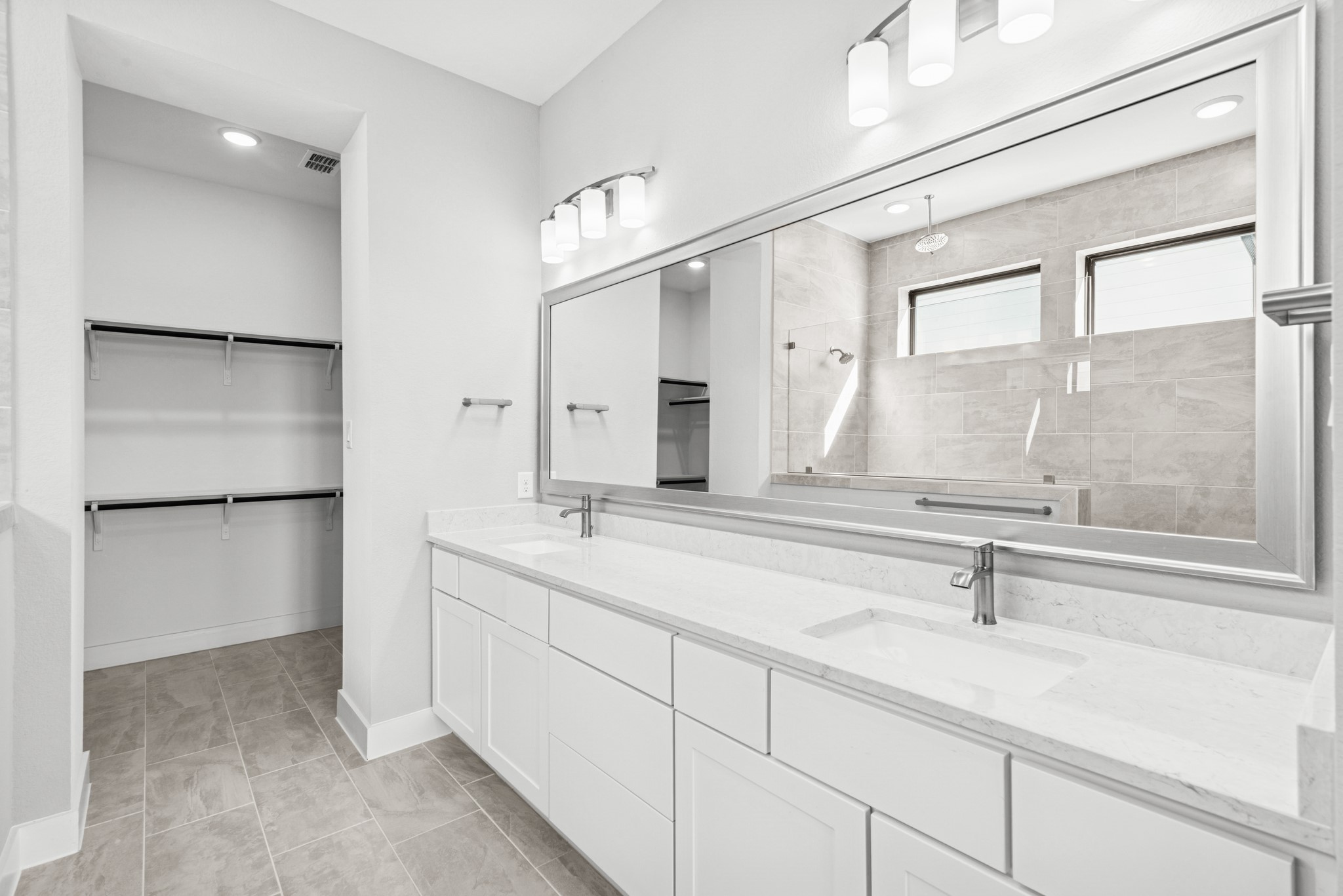 16142 Rita Road Conroe, TX 77302 - Photo 31 of 48 a bathroom with a sink and a mirror