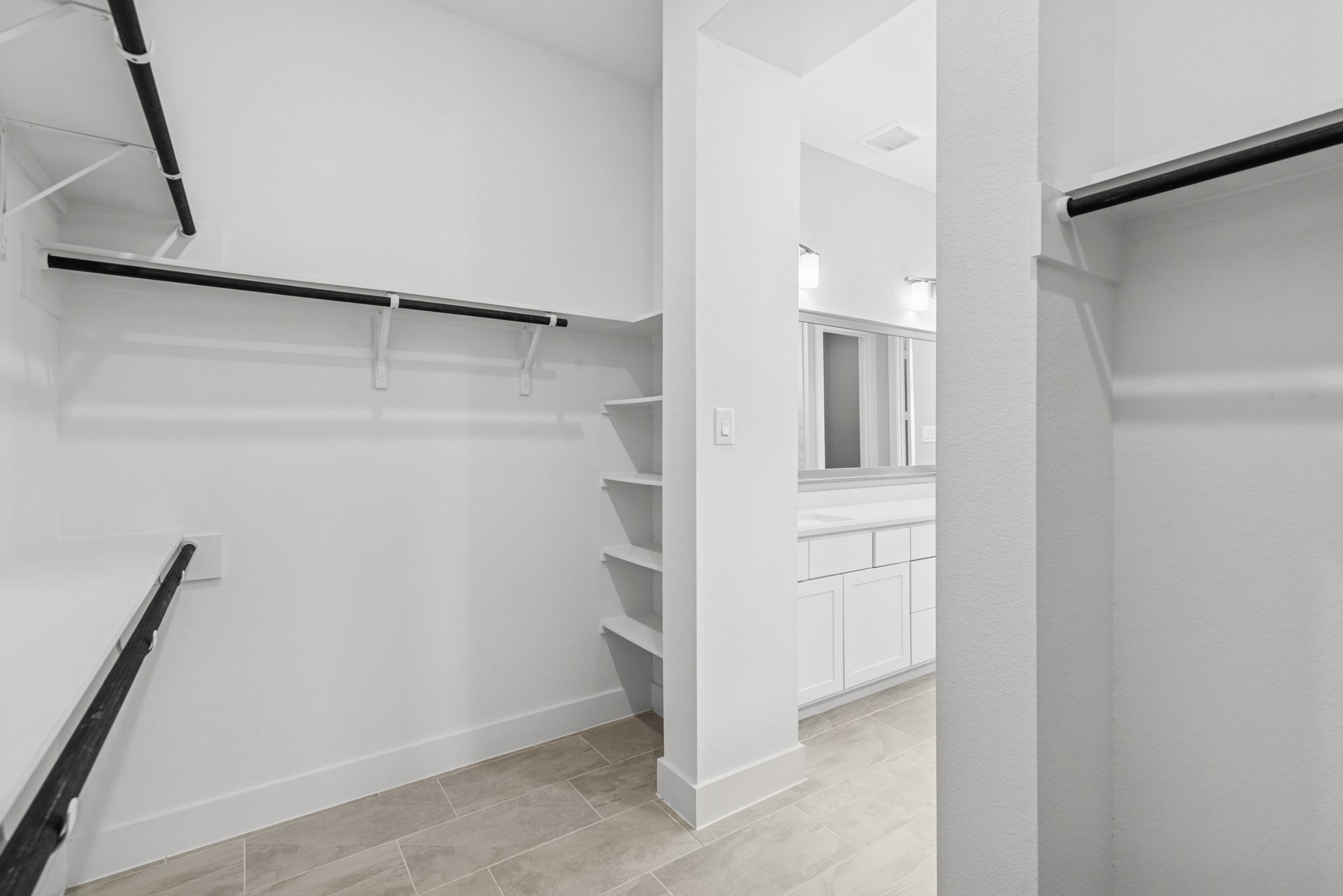 16142 Rita Road Conroe, TX 77302 - Photo 32 of 48 a view of walk in closet with cabinet