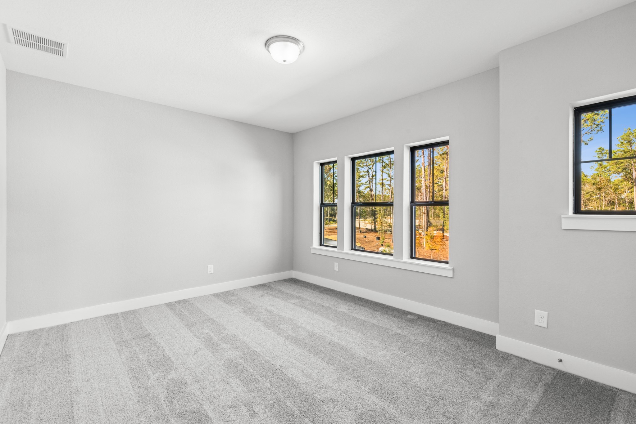 16142 Rita Road Conroe, TX 77302 - Photo 36 of 48 an empty room with a window