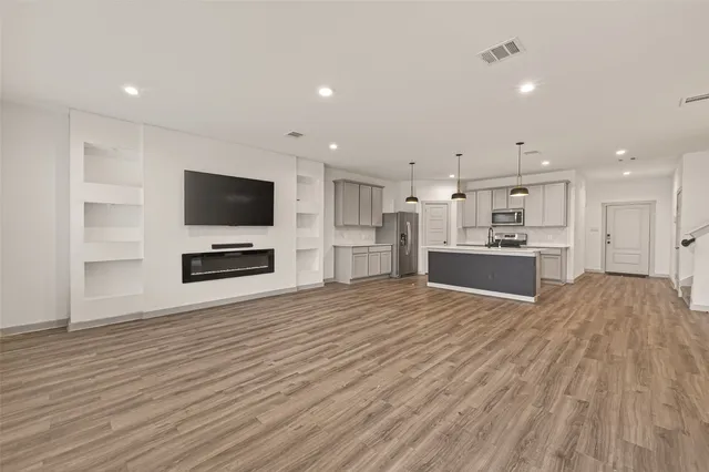 a view of kitchen and kitchen with a flat screen tv