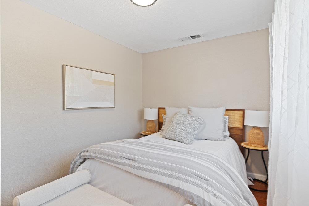 19 Jolley Way Scotts Valley, CA 95066 - Photo 19 of 56 a bedroom with a bed and a lamp on dresser