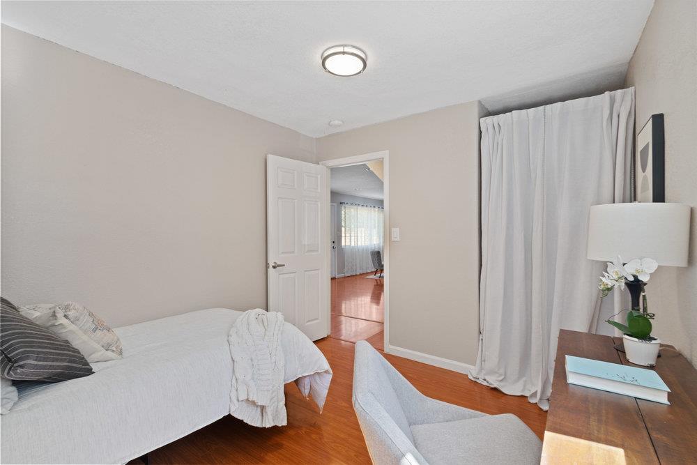 19 Jolley Way Scotts Valley, CA 95066 - Photo 22 of 56 a bedroom with a bed and wooden floor